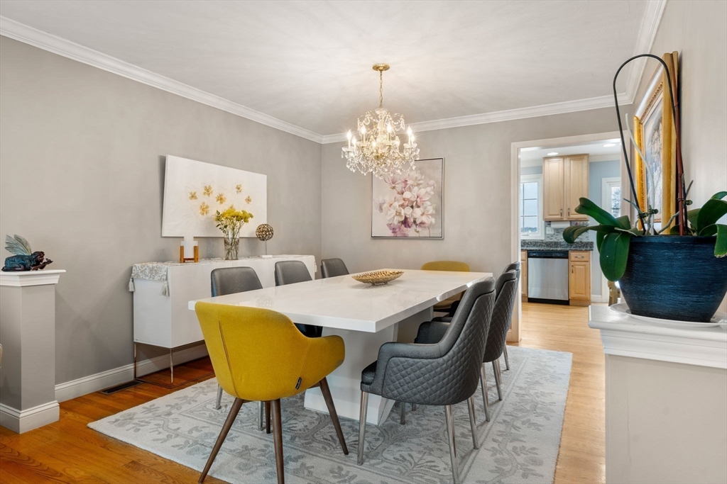 21 Hartwell Place, Unit 21 Canton, MA 02021 - Photo 12 of 33 a view of a dining room with furniture and chandelier