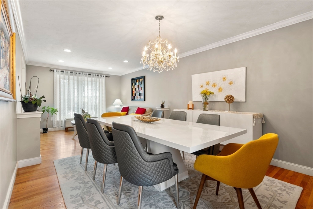 21 Hartwell Place, Unit 21 Canton, MA 02021 - Photo 14 of 33 a view of a dining room with furniture and chandelier