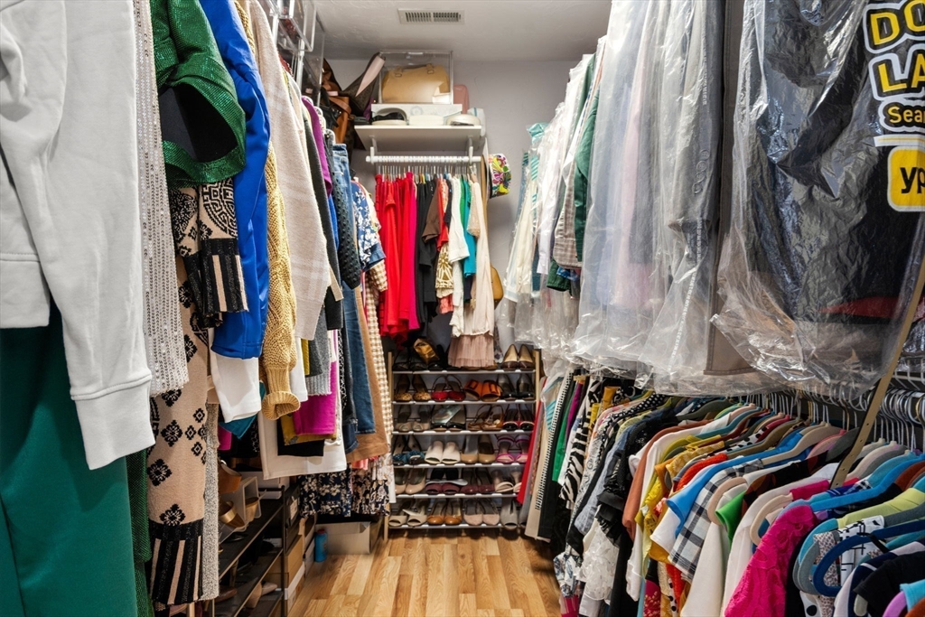 21 Hartwell Place, Unit 21 Canton, MA 02021 - Photo 20 of 33 a view of walk in closet with clothes and shoes