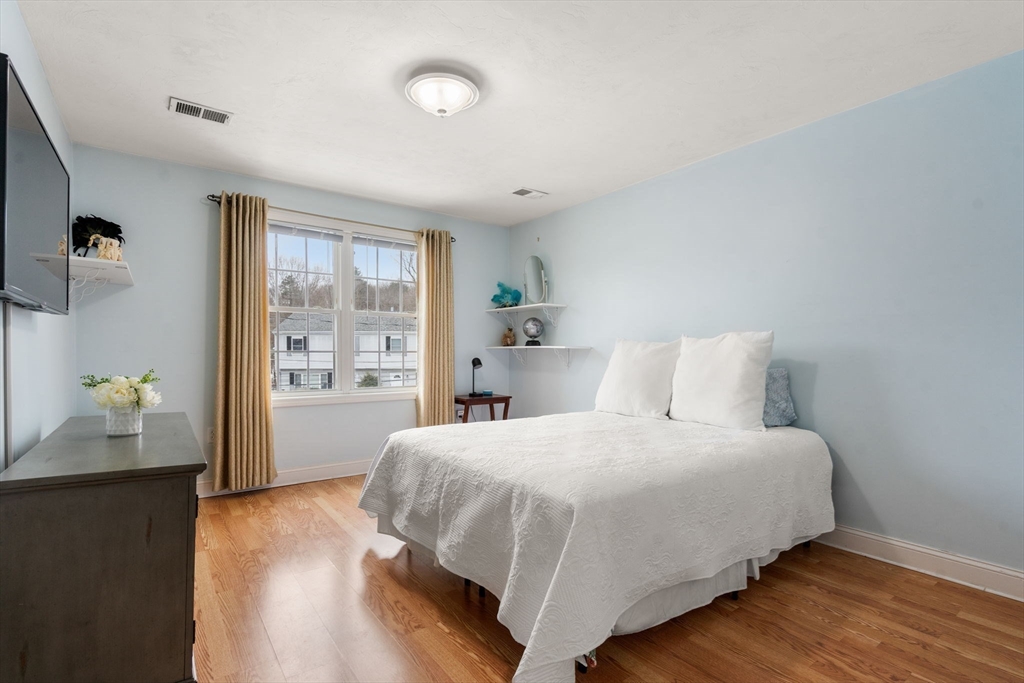 21 Hartwell Place, Unit 21 Canton, MA 02021 - Photo 21 of 33 a bedroom with a bed and window