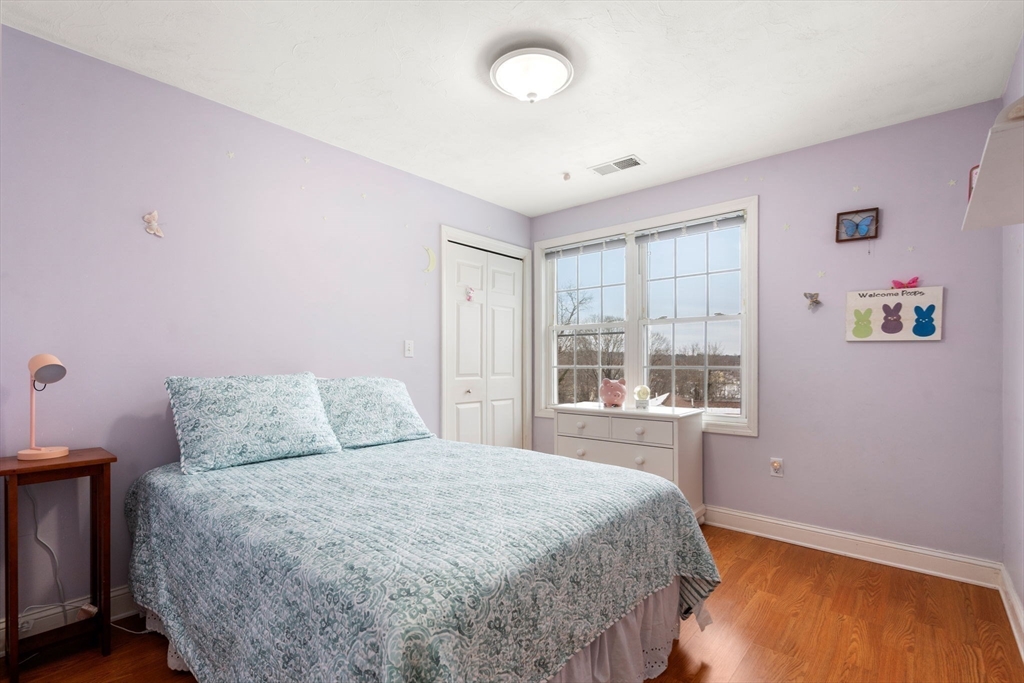21 Hartwell Place, Unit 21 Canton, MA 02021 - Photo 23 of 33 a bedroom with a bed and a window
