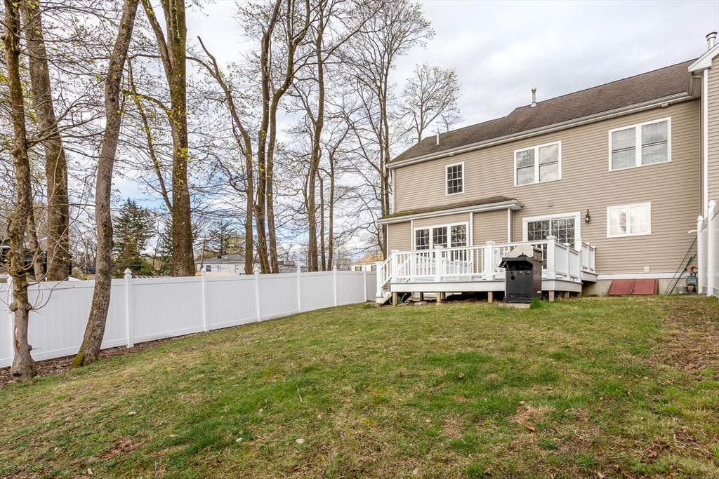 21 Hartwell Place, Unit 21 Canton, MA 02021 - Photo 31 of 33 a view of a house with a backyard