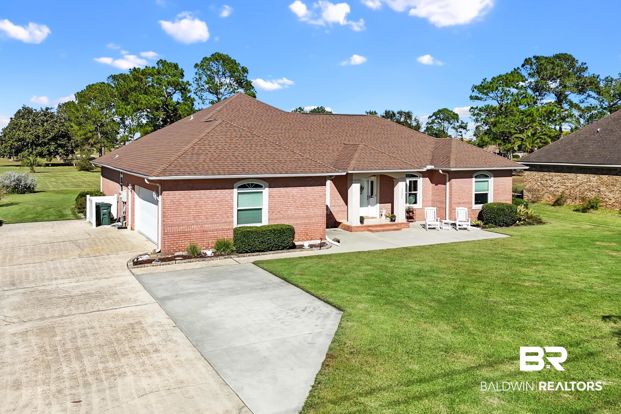 22355 East County Road 12 Foley, AL 36535 - Photo 52 of 54 View of front facade featuring a front lawn, roof with shingles, brick siding, and concrete driveway
