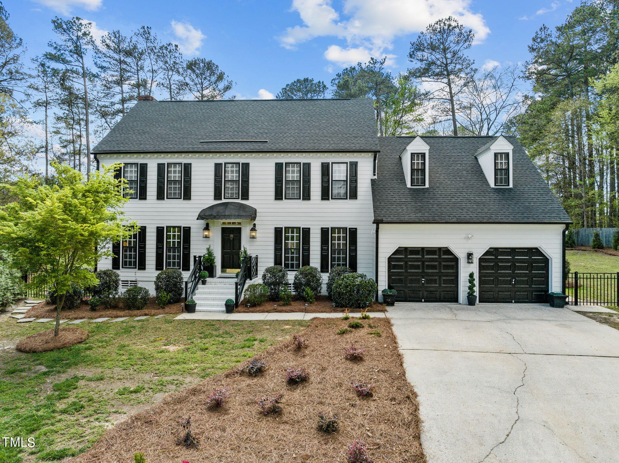 7201 Birchbark Court Raleigh, NC 27615 - Photo 1 of 52 a front view of a house with garden