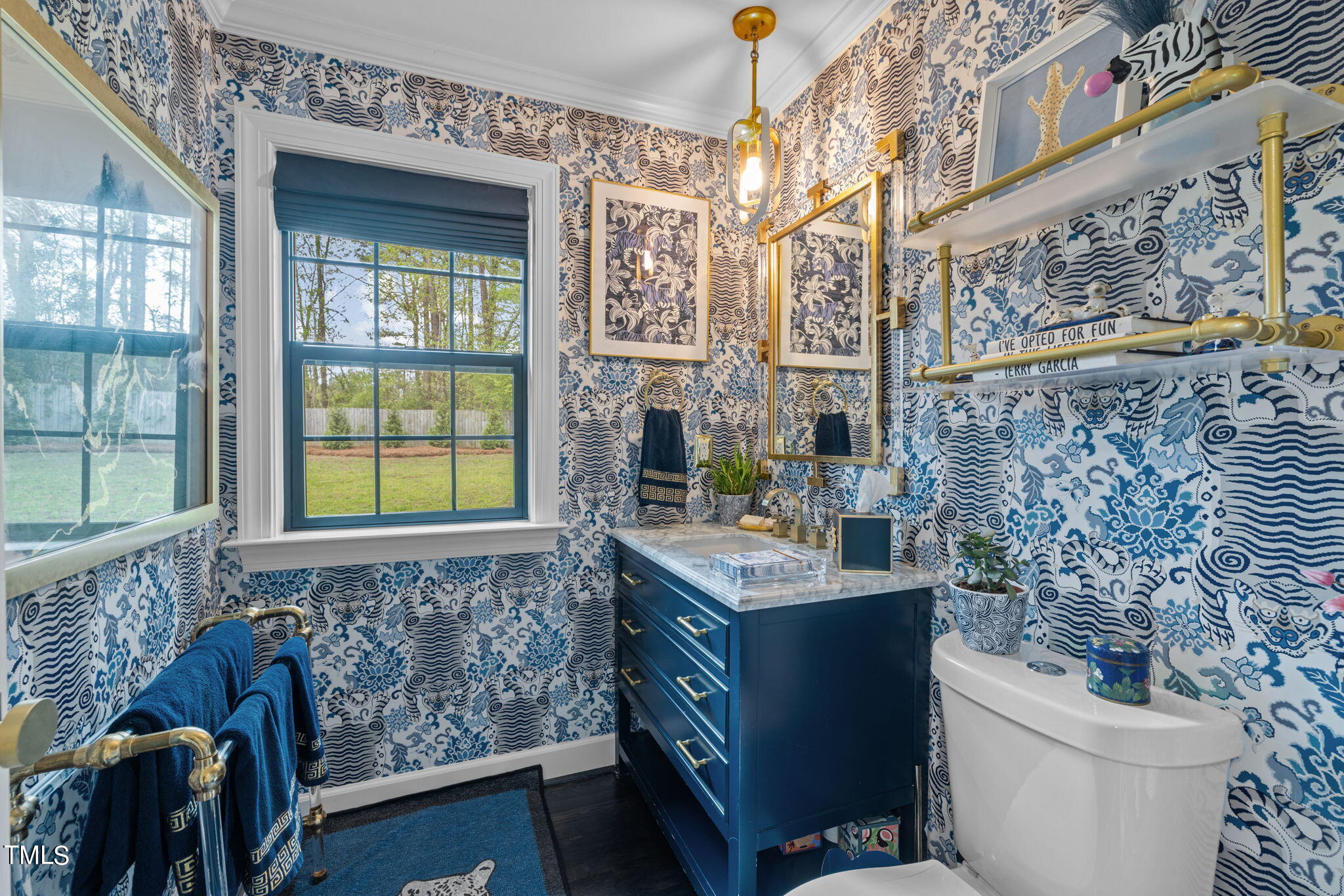 7201 Birchbark Court Raleigh, NC 27615 - Photo 12 of 52 a bathroom with a sink and a toilet