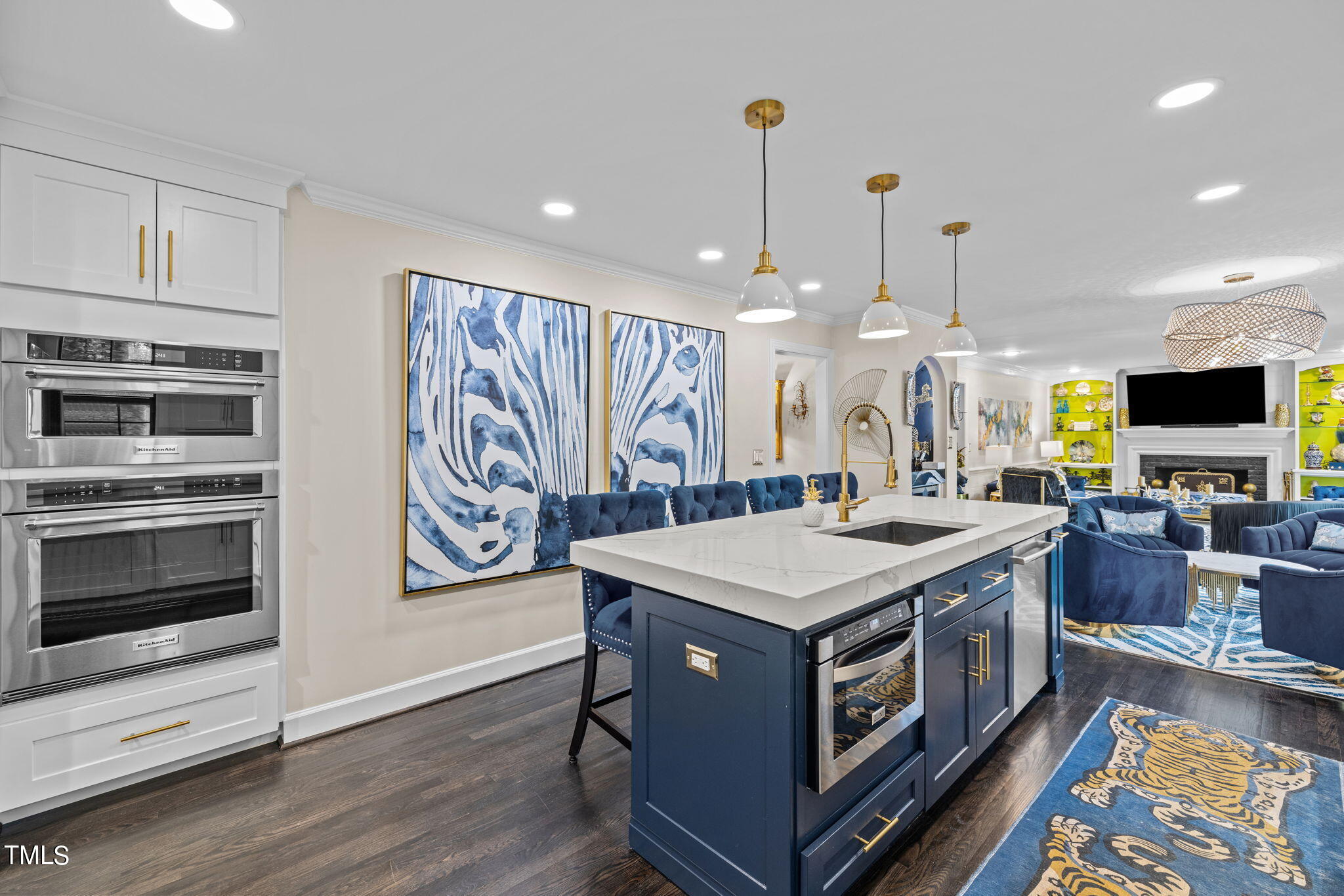 7201 Birchbark Court Raleigh, NC 27615 - Photo 15 of 52 a kitchen with a stove and a microwave