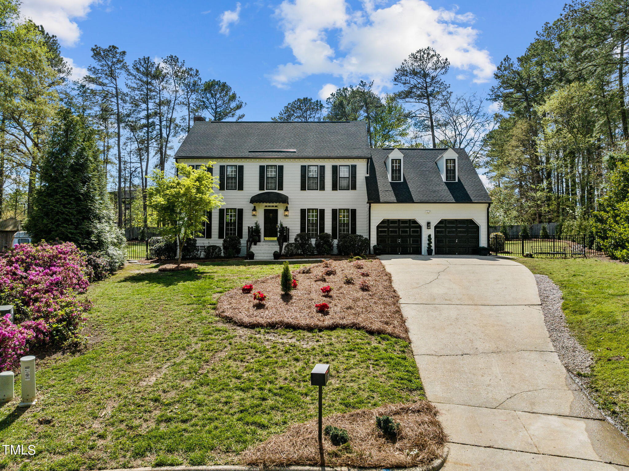 7201 Birchbark Court Raleigh, NC 27615 - Photo 2 of 52 a front view of a house with a yard