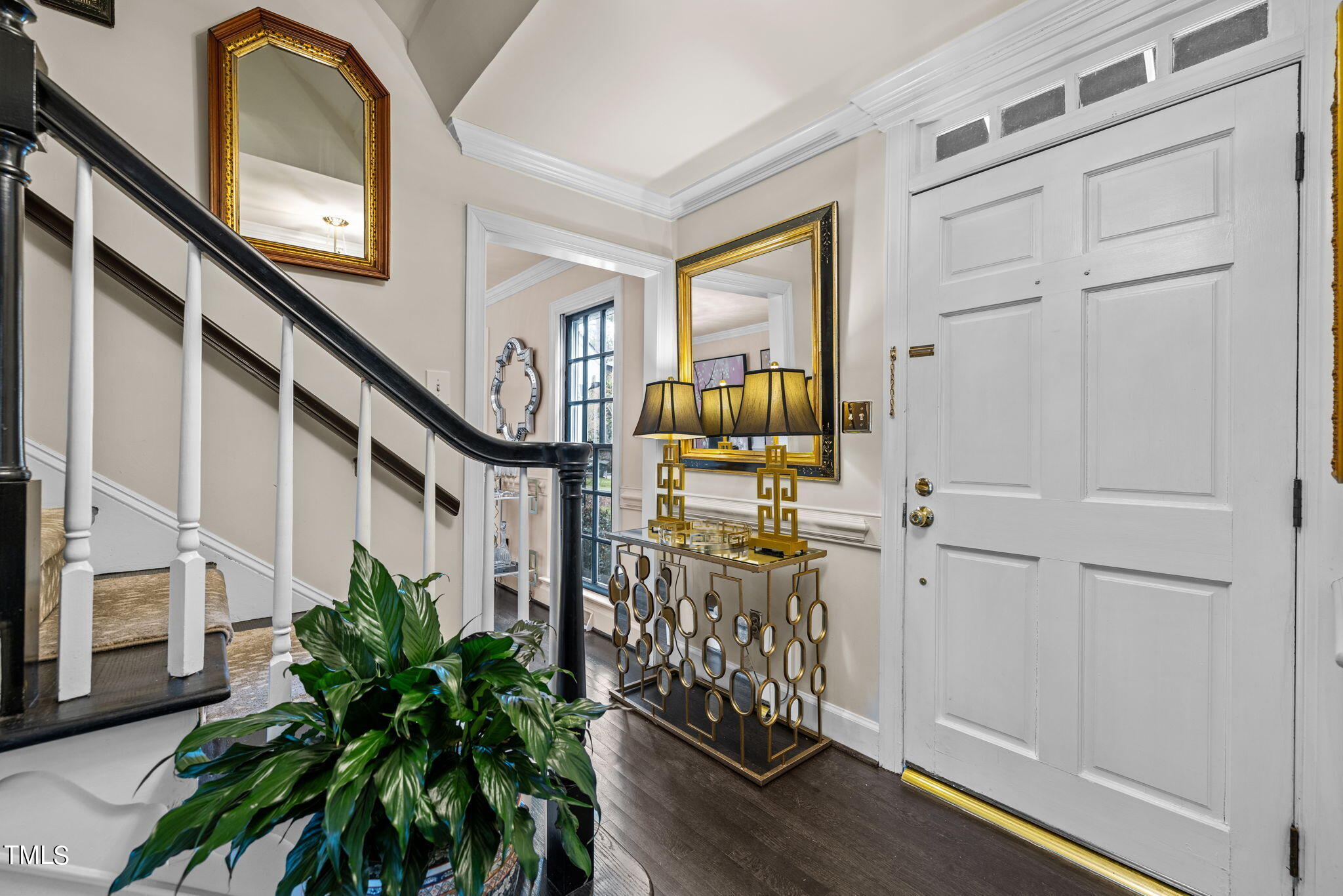 7201 Birchbark Court Raleigh, NC 27615 - Photo 30 of 52 a view of entryway with wooden floor and stairs