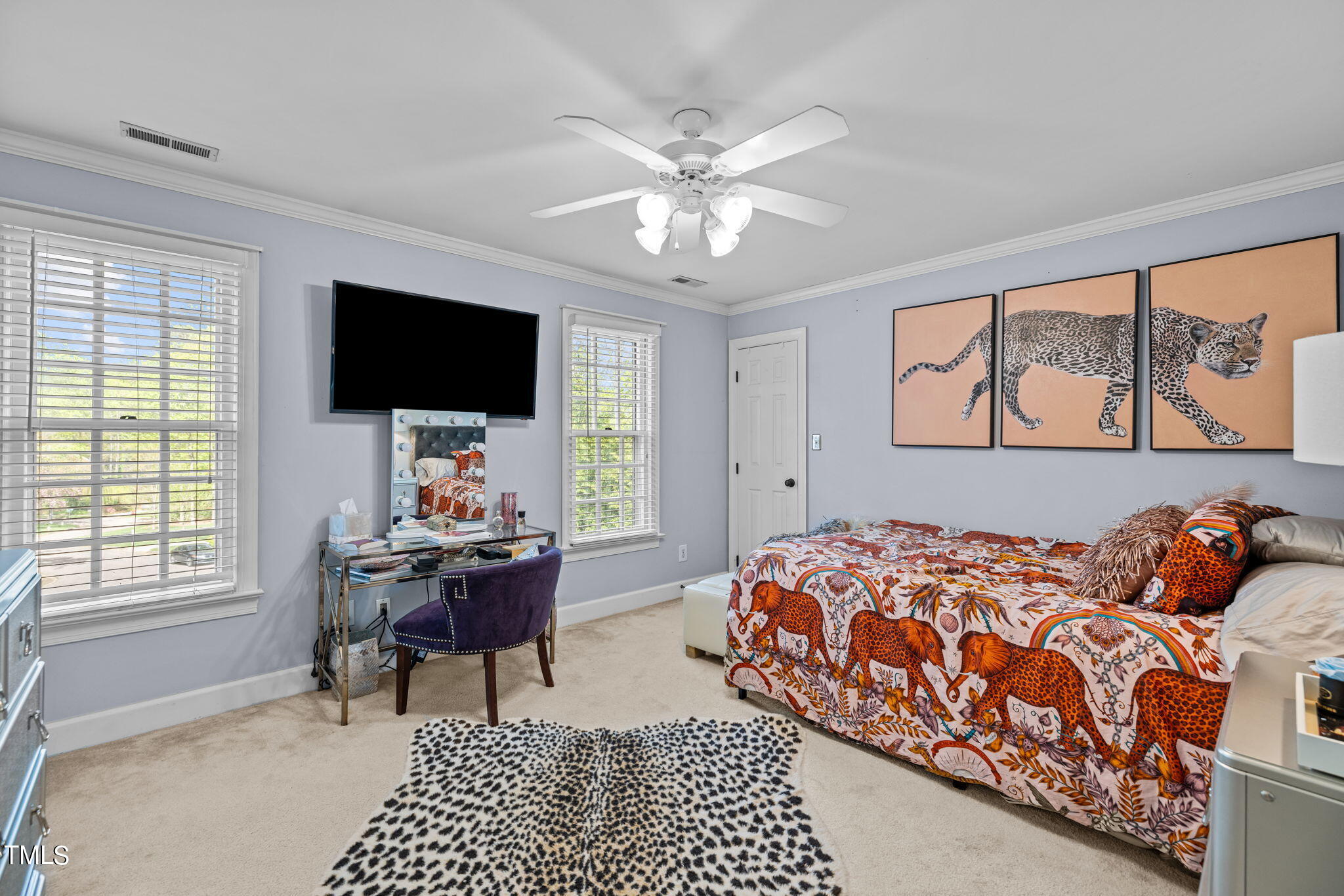 7201 Birchbark Court Raleigh, NC 27615 - Photo 33 of 52 a bedroom with a bed and flat screen tv