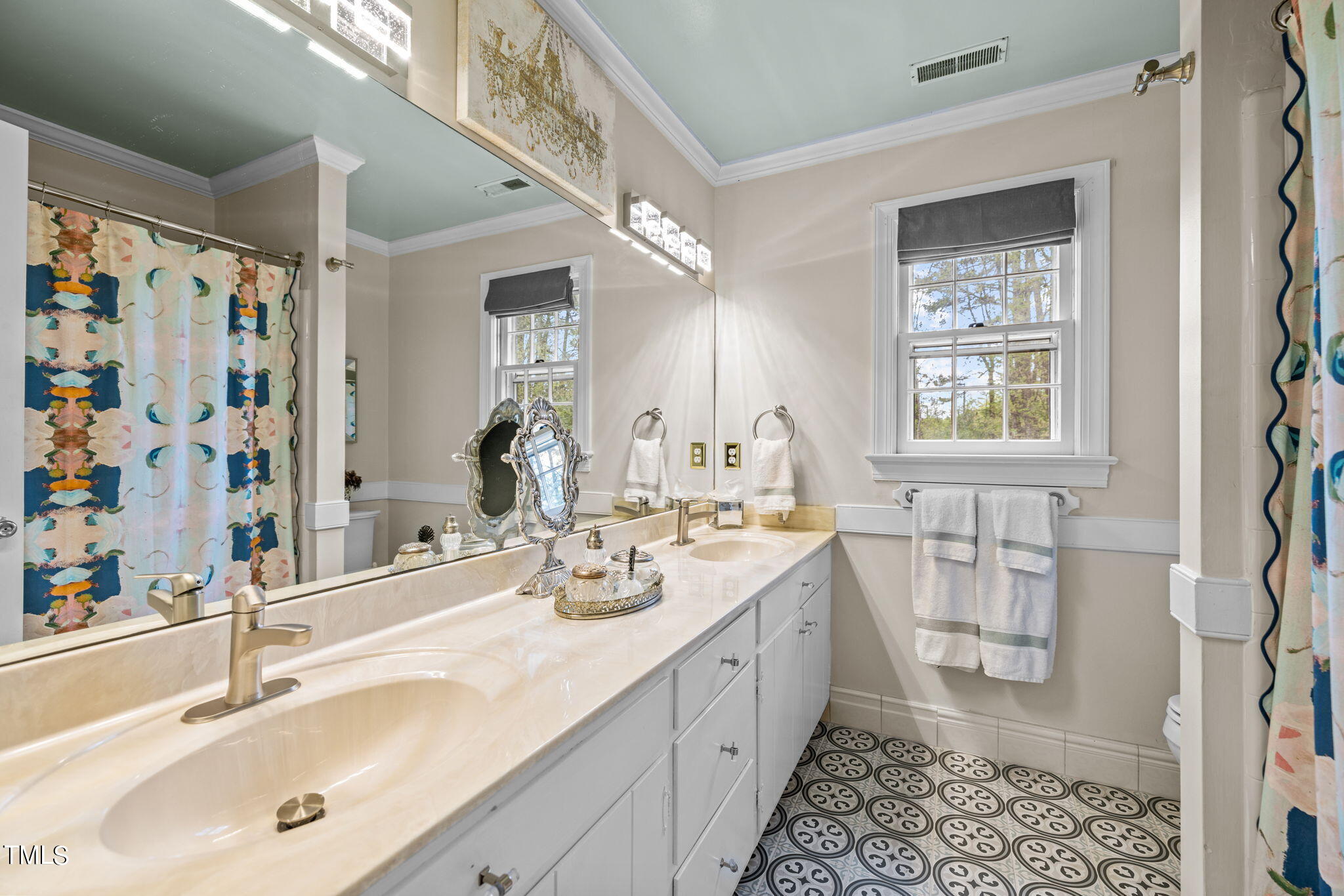 7201 Birchbark Court Raleigh, NC 27615 - Photo 38 of 52 a bathroom with a double vanity sink mirror and shower
