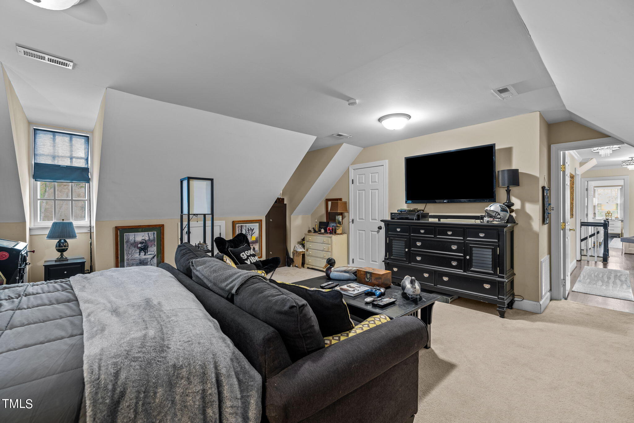 7201 Birchbark Court Raleigh, NC 27615 - Photo 40 of 52 a living room with furniture and a flat screen tv