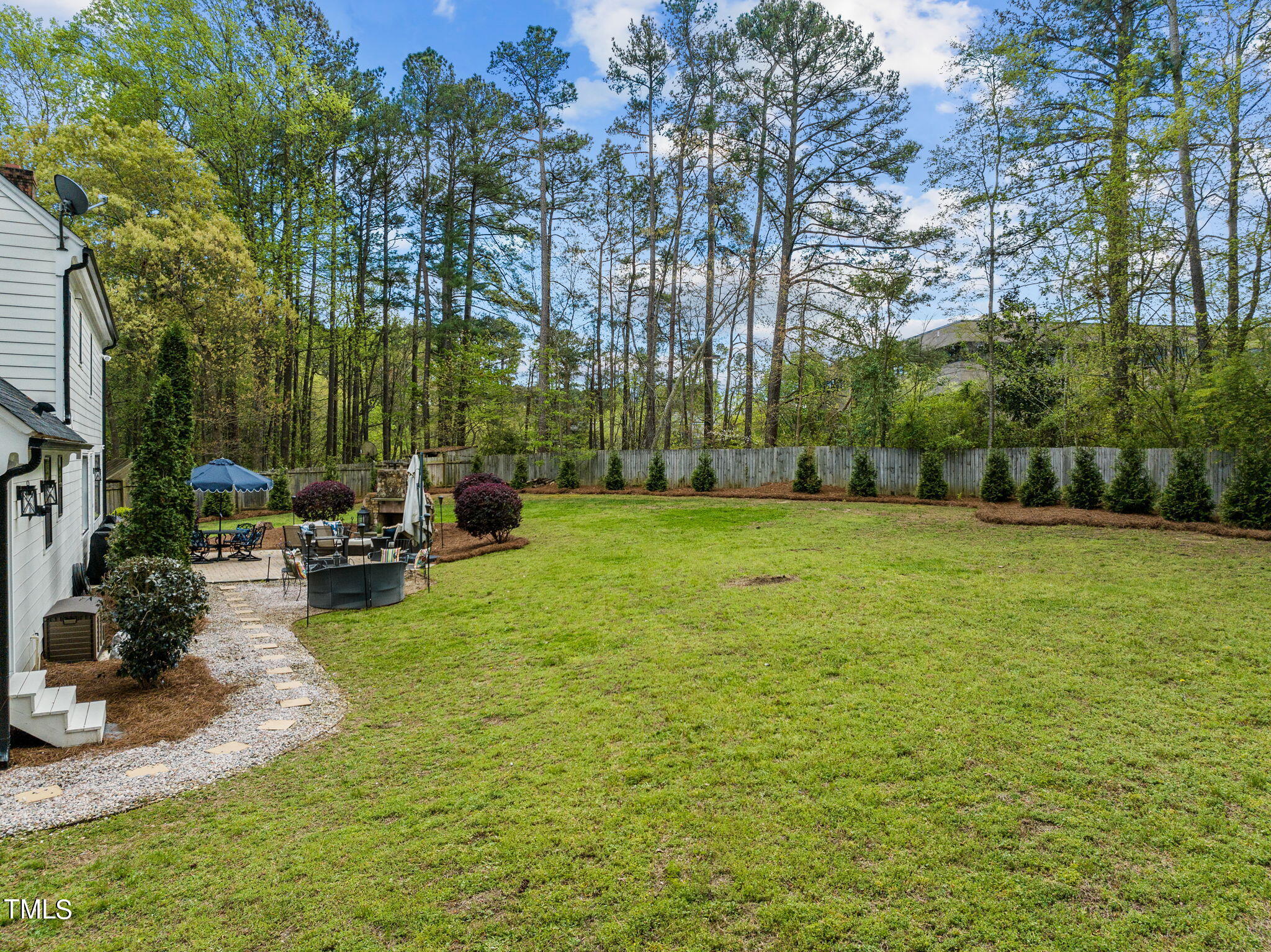 7201 Birchbark Court Raleigh, NC 27615 - Photo 46 of 52 a view of a backyard with sitting area