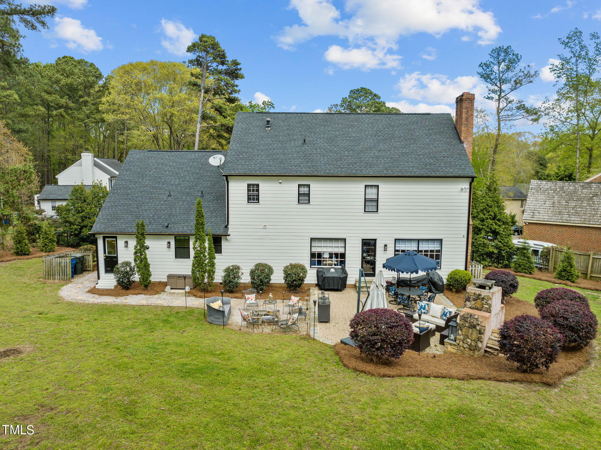 7201 Birchbark Court Raleigh, NC 27615 - Photo 49 of 52 a view of a house with backyard and sitting area