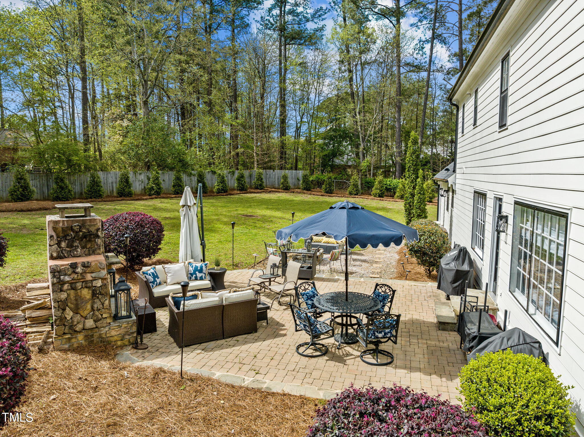 7201 Birchbark Court Raleigh, NC 27615 - Photo 51 of 52 a view of a patio with table and chairs potted plants with lake view