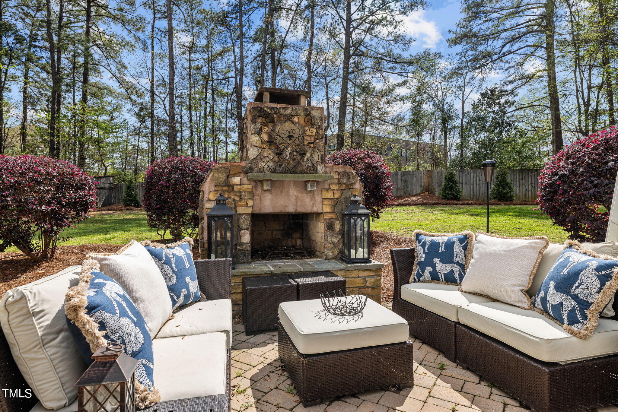 7201 Birchbark Court Raleigh, NC 27615 - Photo 7 of 52 a view of a patio with couches and a fire pit and large trees