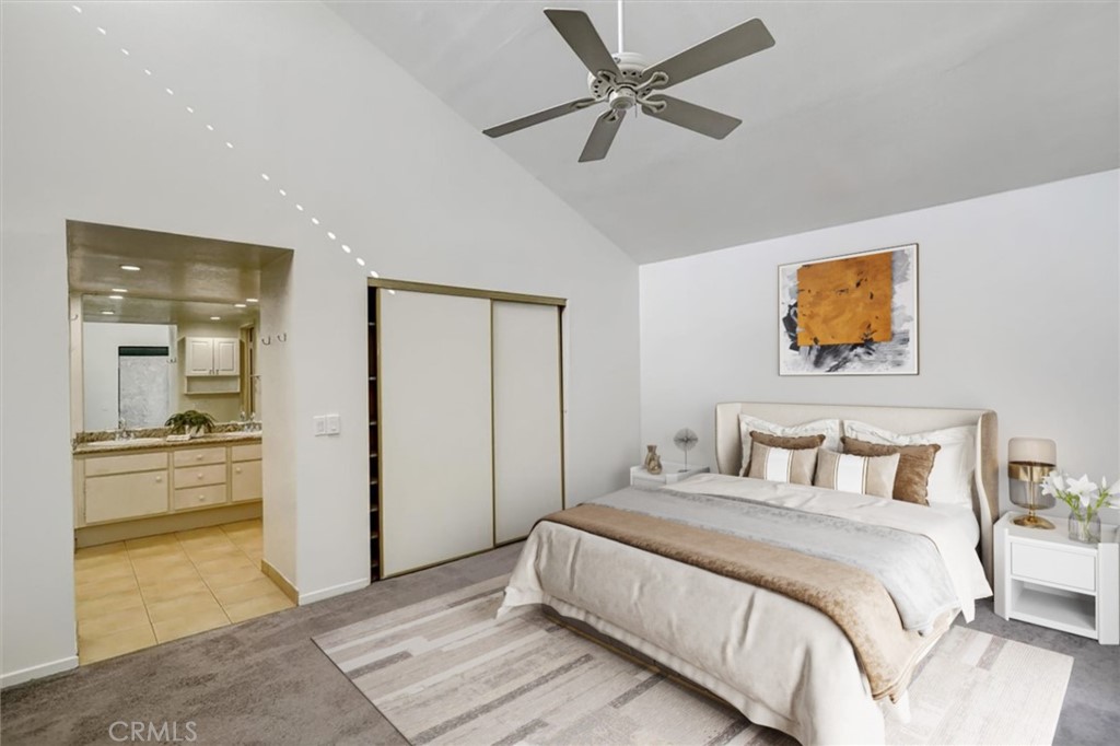 1333 Valley View Road, Unit 18 Glendale, CA 91202 - Photo 23 of 52 a bedroom with a bed and a chandelier