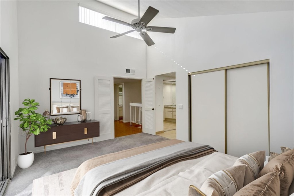 1333 Valley View Road, Unit 18 Glendale, CA 91202 - Photo 24 of 52 a bedroom with a large bed and a chandelier