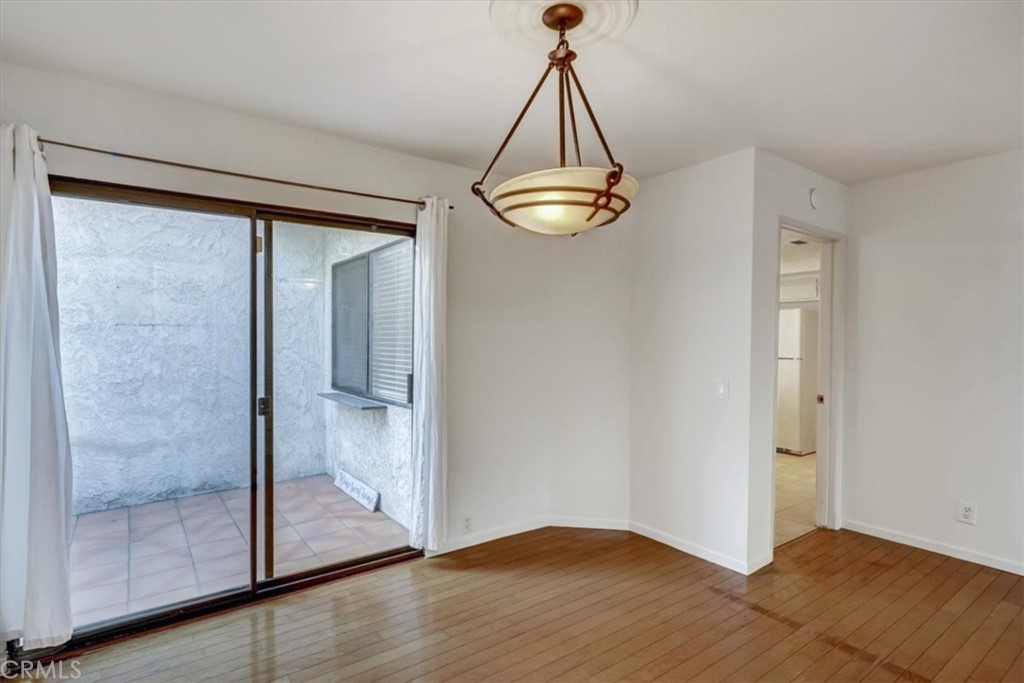 1333 Valley View Road, Unit 18 Glendale, CA 91202 - Photo 41 of 52 a view of a chandelier fan and wooden floor in a room