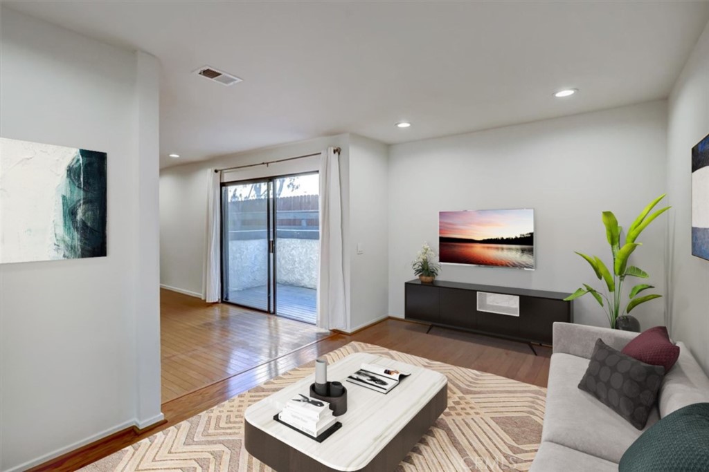 1333 Valley View Road, Unit 18 Glendale, CA 91202 - Photo 7 of 52 a living room with furniture a flat screen tv and a potted plant