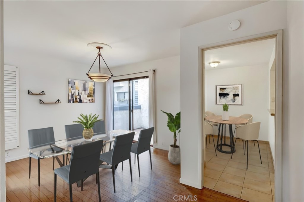 1333 Valley View Road, Unit 18 Glendale, CA 91202 - Photo 9 of 52 a view of a dining room with furniture a chandelier and wooden floor