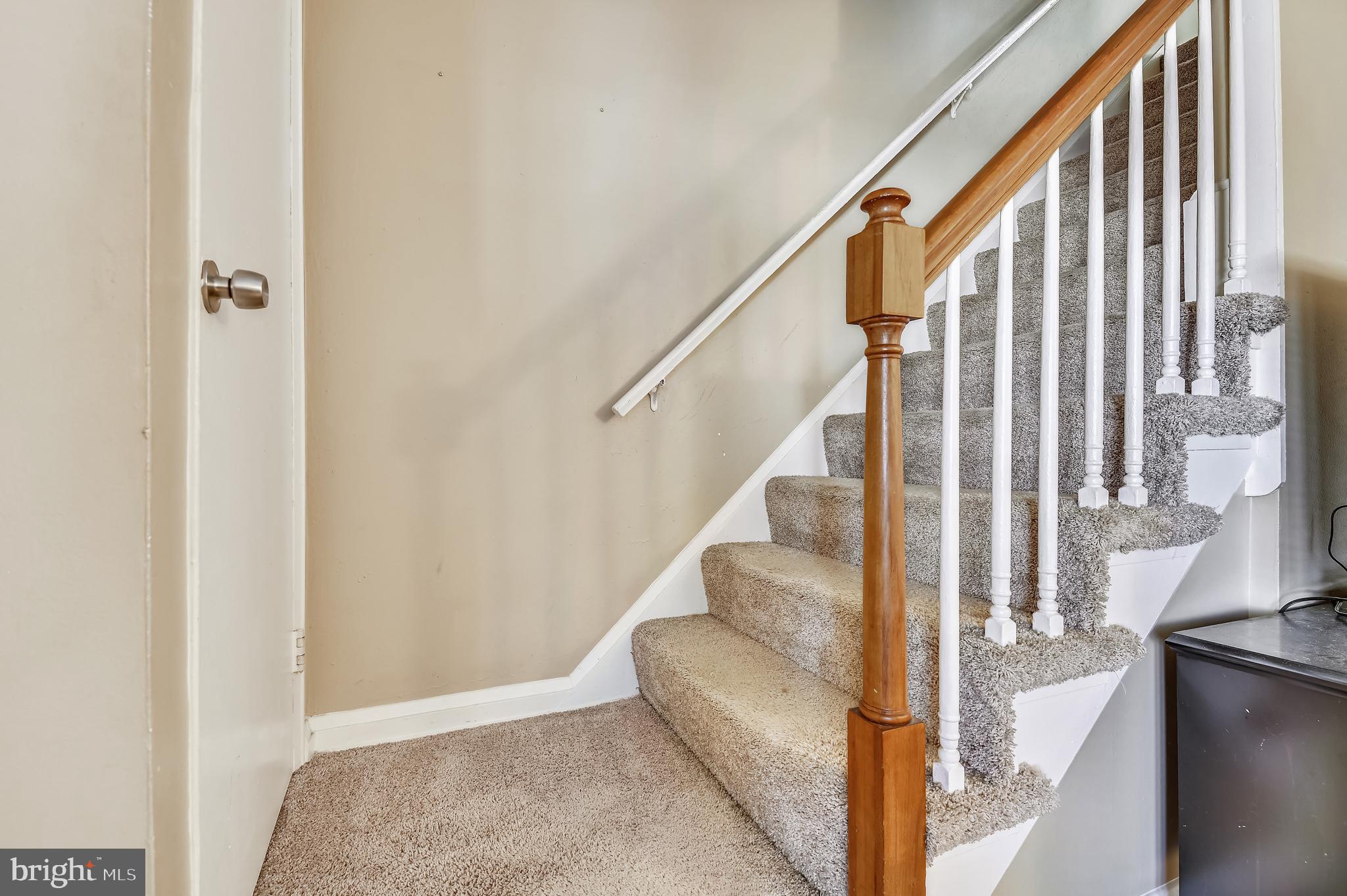 3409 North Point Road Dundalk, MD 21222 - Photo 21 of 36 a view of staircase with wooden floor and furniture
