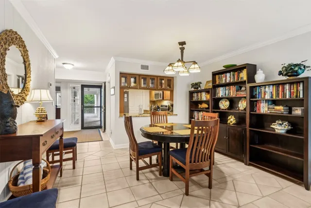 a living room with furniture a flat screen tv and a large window