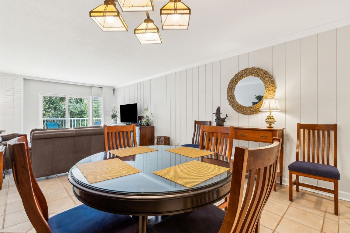 2123 Beachwood Road, Unit 2123 Fernandina Beach, FL 32034 - Photo 13 of 64 a view of a dining room with furniture window and wooden floor