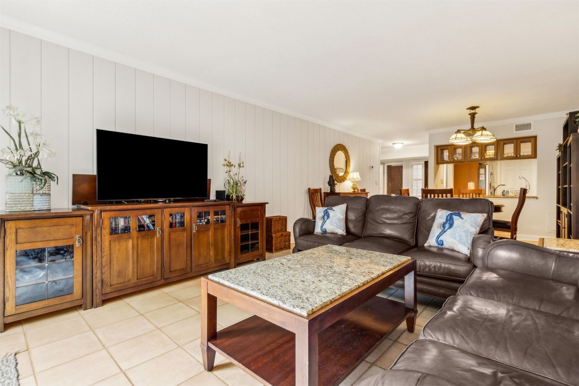 2123 Beachwood Road, Unit 2123 Fernandina Beach, FL 32034 - Photo 15 of 64 a living room with furniture and a flat screen tv
