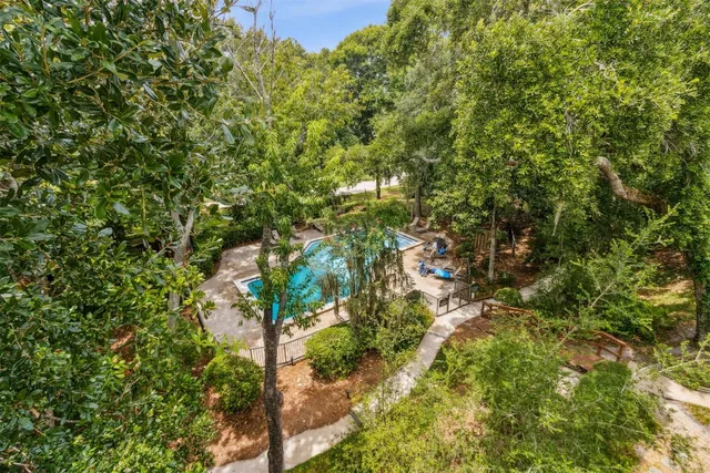 a bedroom with a bed and a lamp on table