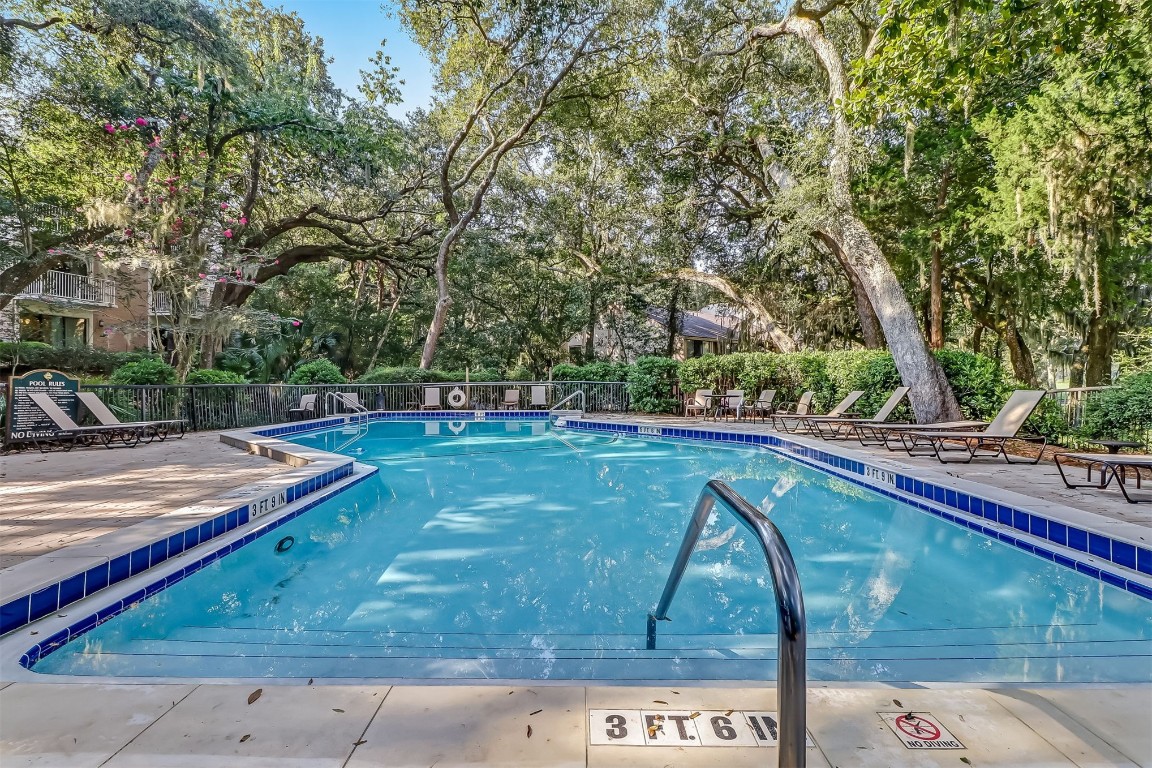 2123 Beachwood Road, Unit 2123 Fernandina Beach, FL 32034 - Photo 19 of 64 a view of swimming pool with a yard and sitting space
