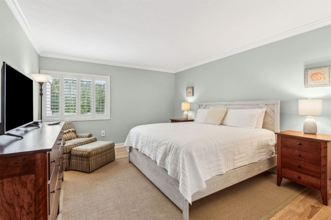 2123 Beachwood Road, Unit 2123 Fernandina Beach, FL 32034 - Photo 20 of 64 a bedroom with a bed and a flat screen tv