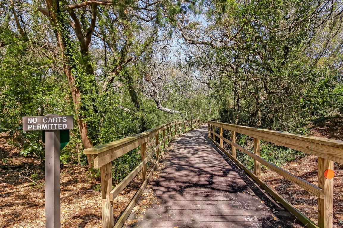 2123 Beachwood Road, Unit 2123 Fernandina Beach, FL 32034 - Photo 34 of 64 a view of balcony with wooden floor and fence