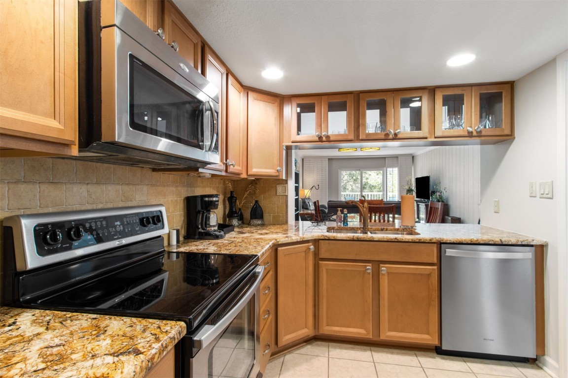 2123 Beachwood Road, Unit 2123 Fernandina Beach, FL 32034 - Photo 8 of 64 a kitchen with a stove a sink and a microwave