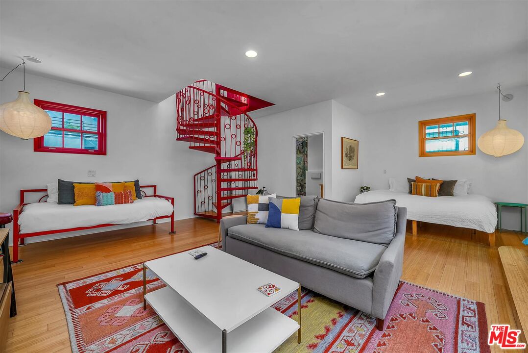 2419 Ocean Avenue Venice, CA 90291 - Photo 14 of 41 a living room with furniture and a flat screen tv