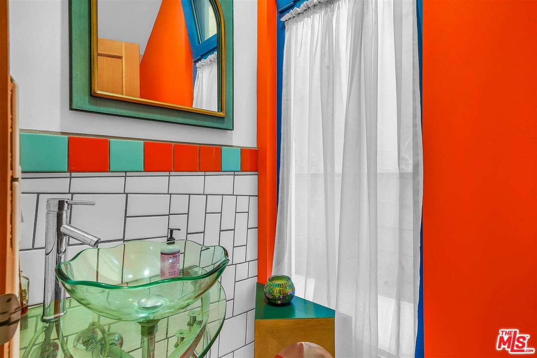 2419 Ocean Avenue Venice, CA 90291 - Photo 20 of 41 a bathroom with a sink and a mirror