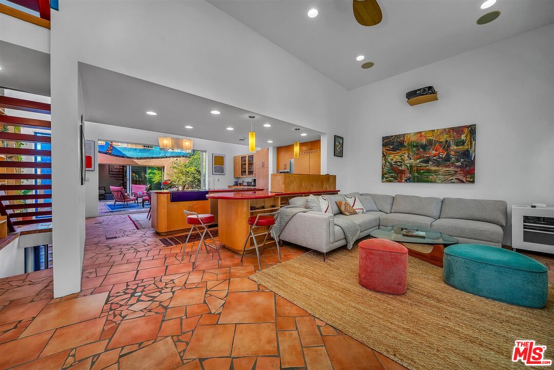 2419 Ocean Avenue Venice, CA 90291 - Photo 2 of 41 a living room with furniture a rug and a flat screen tv