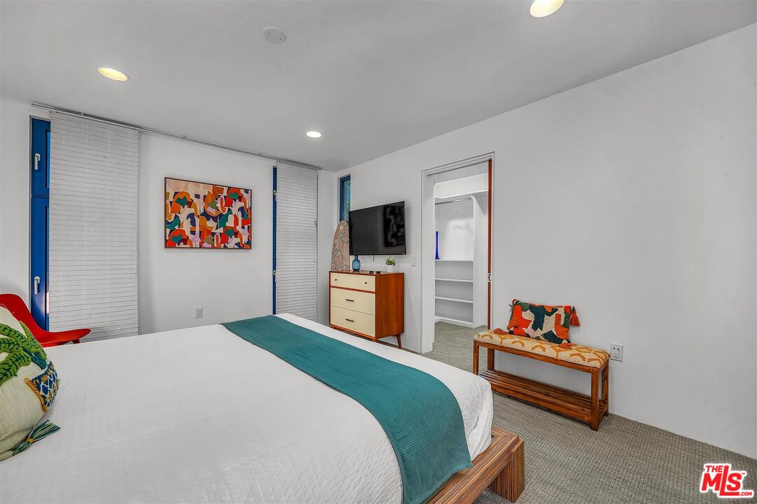 2419 Ocean Avenue Venice, CA 90291 - Photo 22 of 41 a bedroom with a bed and a flat screen tv