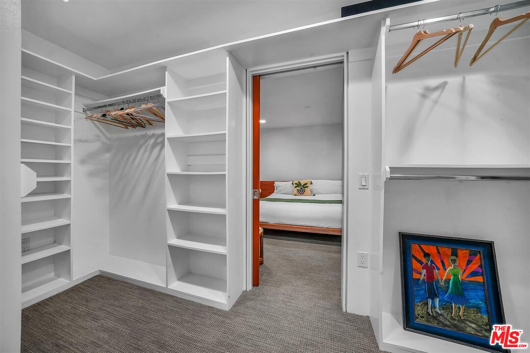 2419 Ocean Avenue Venice, CA 90291 - Photo 23 of 41 a view of a bedroom with a bed and a window