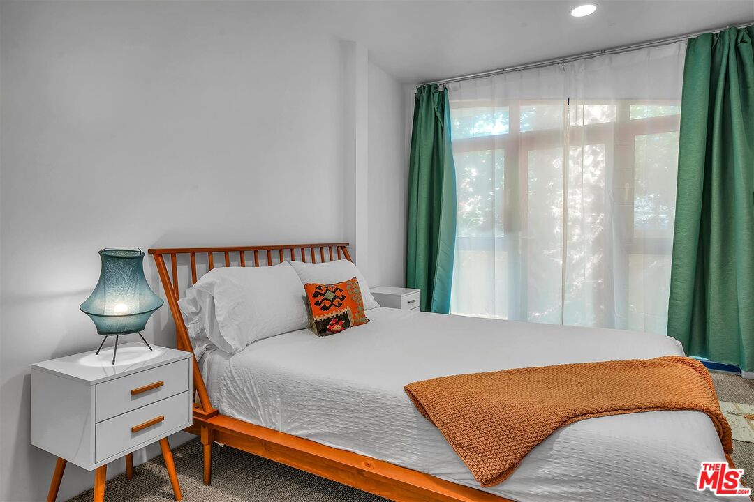 2419 Ocean Avenue Venice, CA 90291 - Photo 25 of 41 a bedroom with a bed and window
