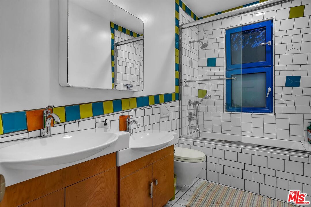 2419 Ocean Avenue Venice, CA 90291 - Photo 26 of 41 a bathroom with a sink a toilet and shower