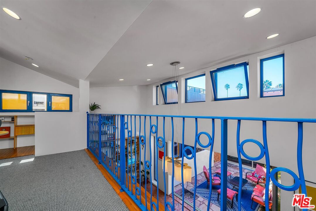 2419 Ocean Avenue Venice, CA 90291 - Photo 31 of 41 a hallway with painting on wall and a large window