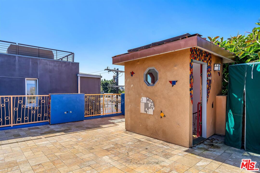 2419 Ocean Avenue Venice, CA 90291 - Photo 36 of 41 a view of a house with entryway doors and wooden fence