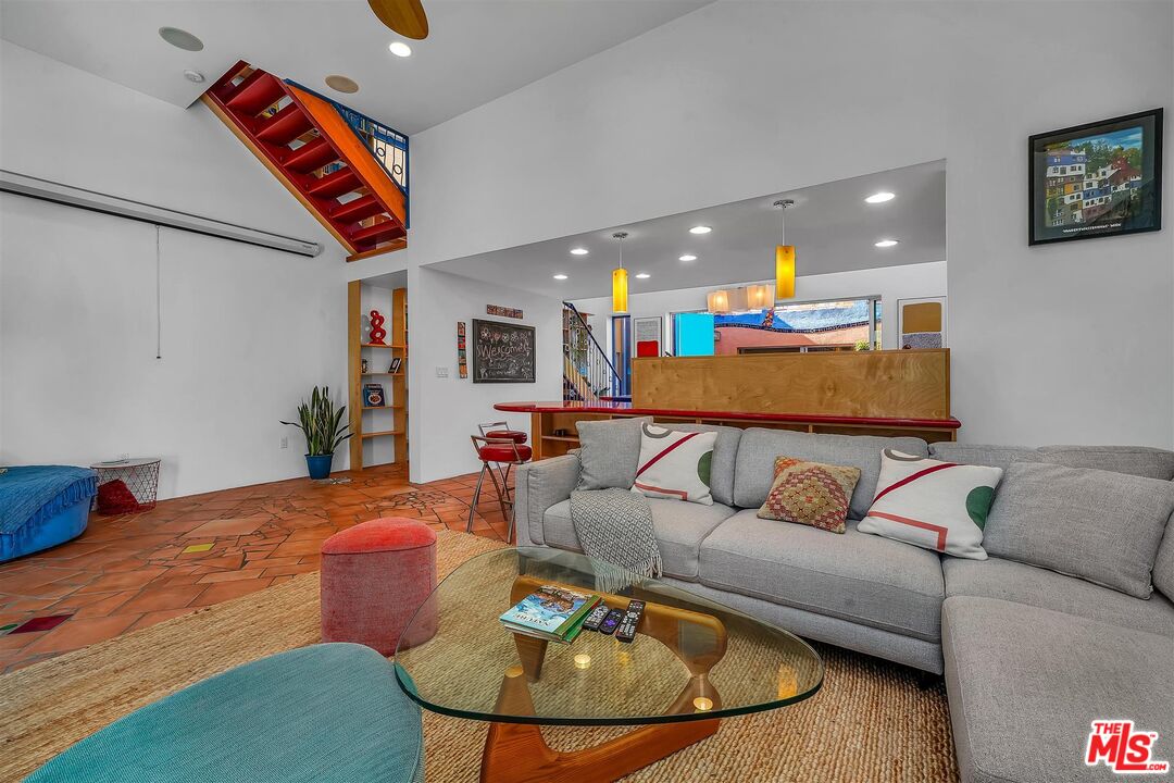 2419 Ocean Avenue Venice, CA 90291 - Photo 5 of 41 a living room with furniture kitchen view and a chandelier