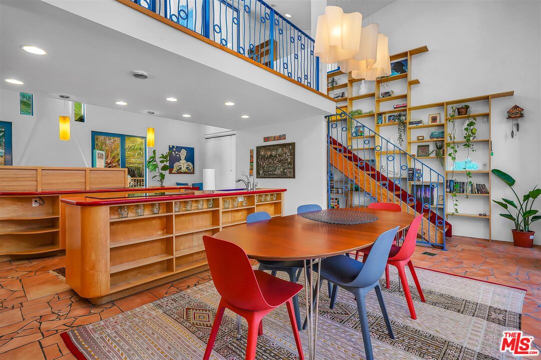 2419 Ocean Avenue Venice, CA 90291 - Photo 9 of 41 a dining room with furniture and a floor to ceiling window