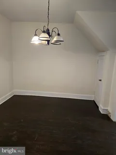 a view of a hardwood floor in a room