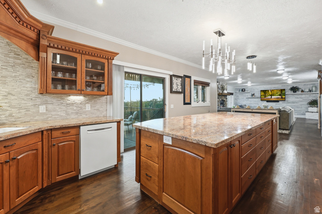 2342 Charros Road Sandy, UT 84092 - Photo 23 of 94 Kitchen featuring a large island with stone countertop and ample cabinetry