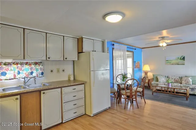 a kitchen with stainless steel appliances a sink cabinets and a counter top space