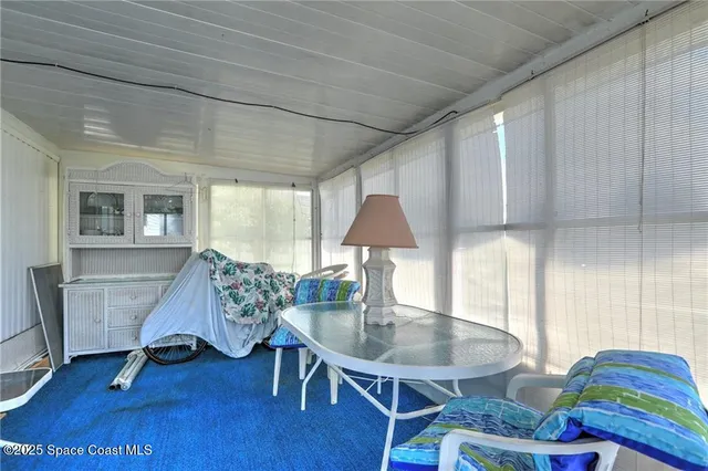 a living room with furniture and a gate