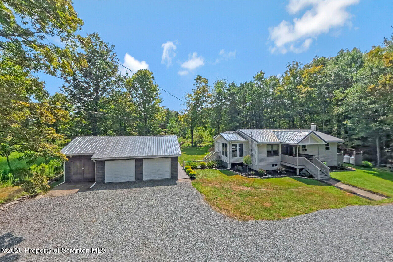 3660 Aberdeen Road Moscow, PA 18444 - Photo 1 of 68 an aerial view of a house with swimming pool and large trees
