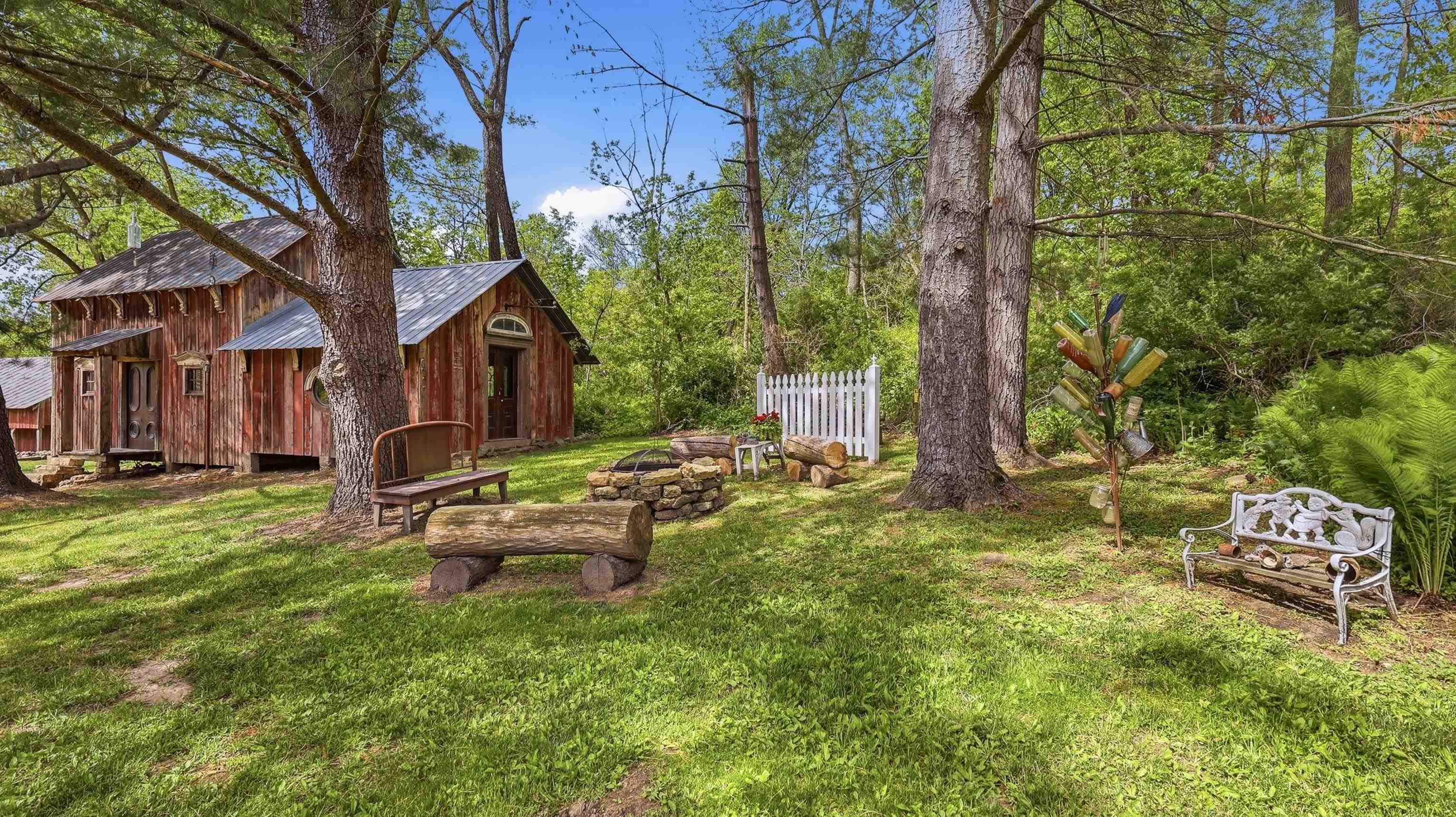 2562 West Blackjack Road Galena, IL 61036 - Photo 53 of 75 a backyard of a house with table and chairs